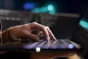 cybersecurity expert using laptop look company security vulnerabilities